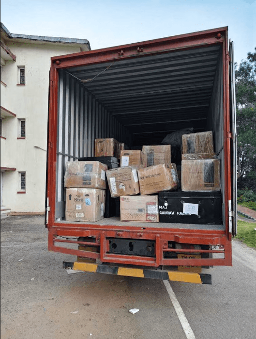 Team loading boxes into truck
